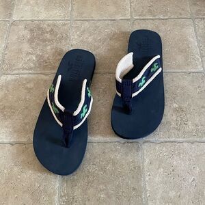 Hollister Men’s Flip Flops with Green Accents.  New without tags